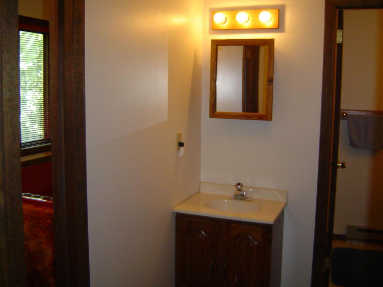 692 Decker Road Bushkill, PA 18324 - Photo 6 of 10 a bathroom with a sink and a mirror