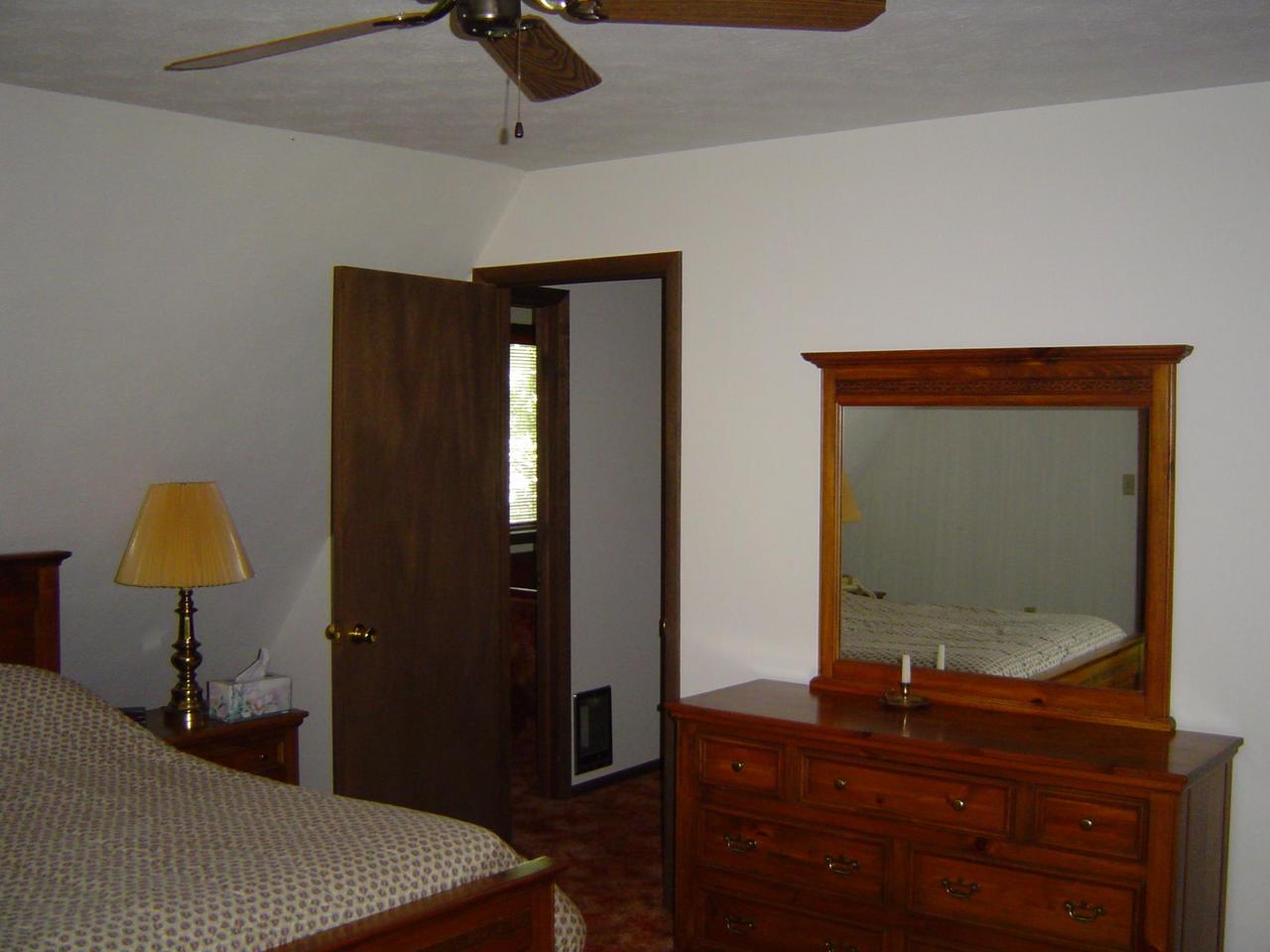 692 Decker Road Bushkill, PA 18324 - Photo 8 of 10 a bedroom with a bed and a dresser
