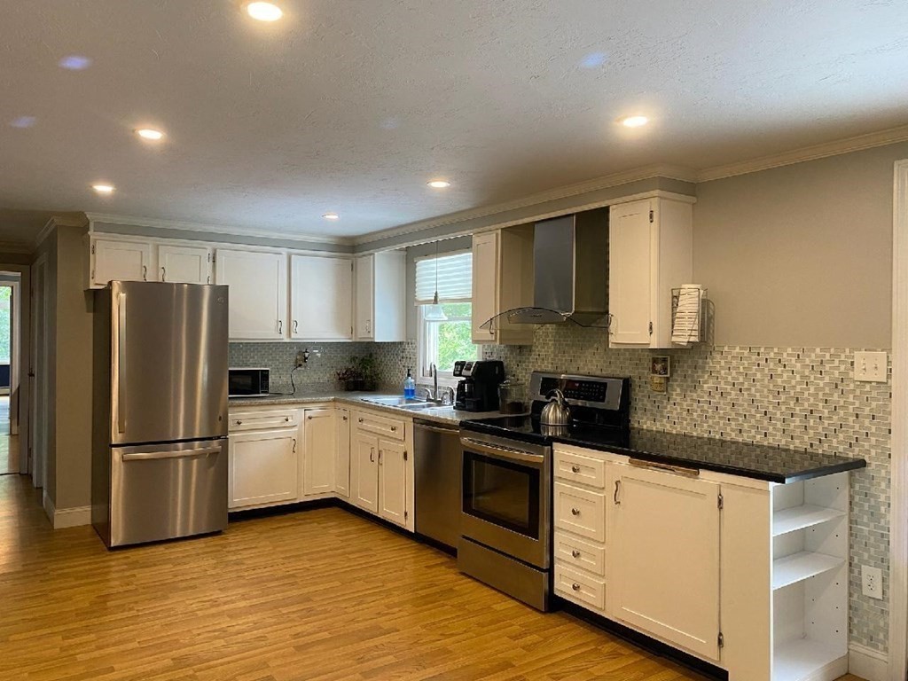 46 Apple Road Brimfield, MA 01010 - Photo 4 of 37 a kitchen with granite countertop a refrigerator stove top oven and sink