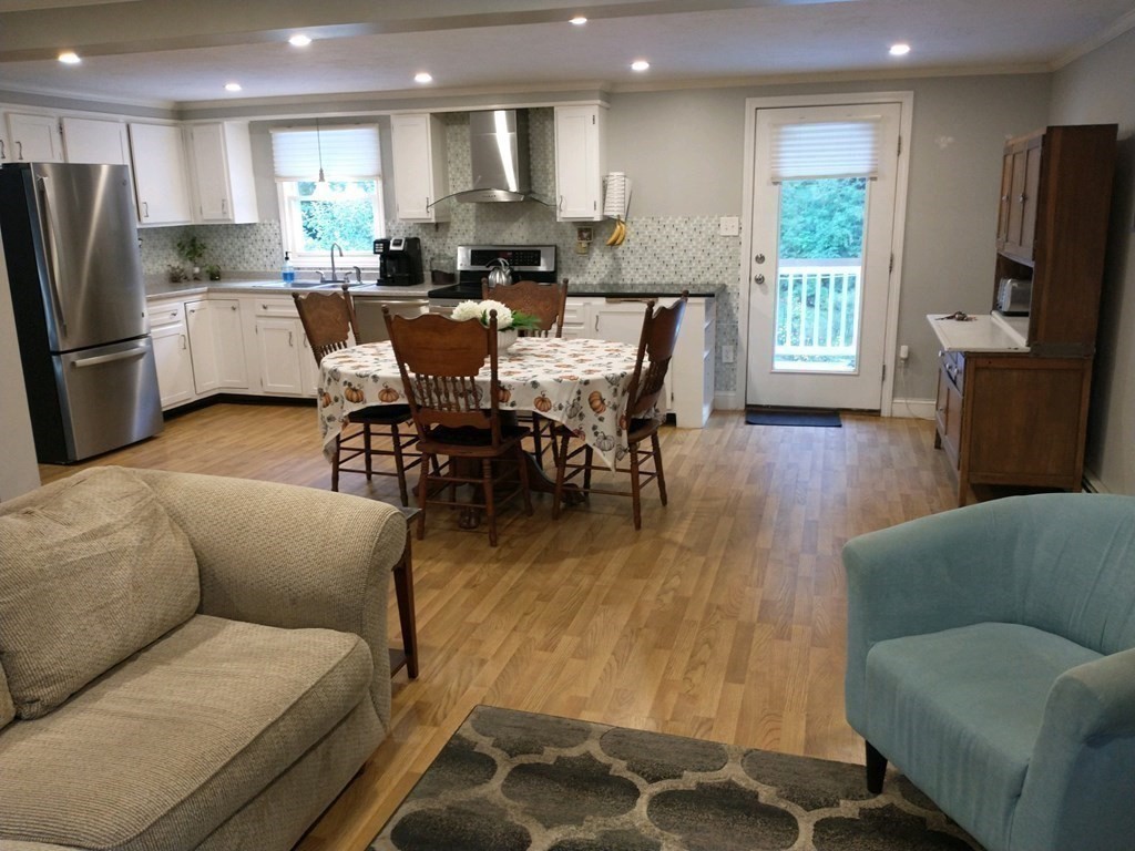 46 Apple Road Brimfield, MA 01010 - Photo 5 of 37 a dining room with furniture a large window and stainless steel appliances