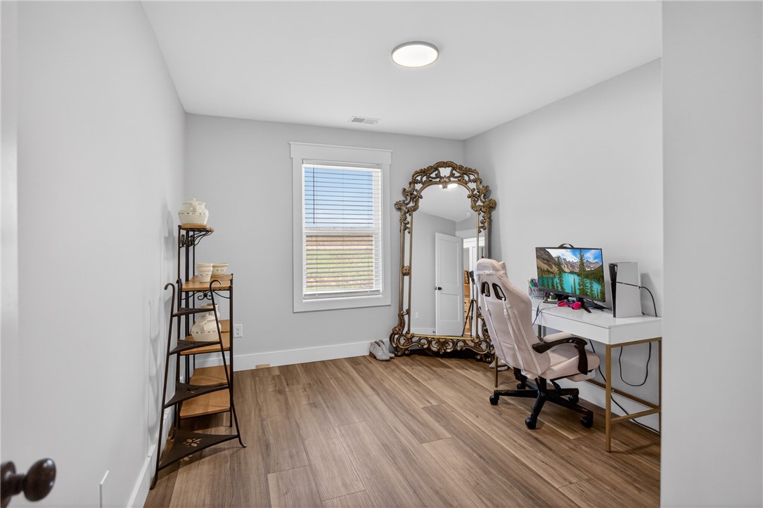 106 Bolt Road Townville, SC 29689 - Photo 21 of 33 A quiet flex room offers wood-look flooring and a bright window for a comfortable workspace.