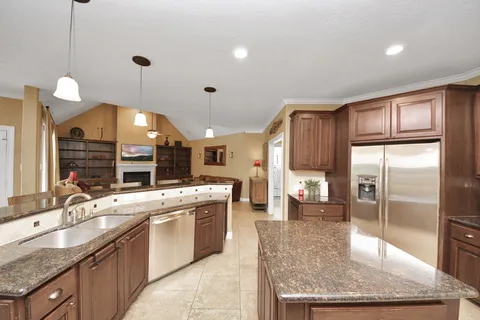 a living room with furniture fireplace and flat screen tv