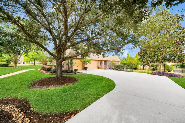 a swimming pool with outdoor seating and yard