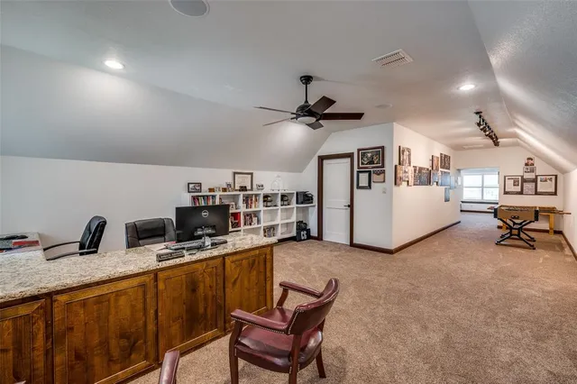 a kitchen room with a refrigerator and a sink