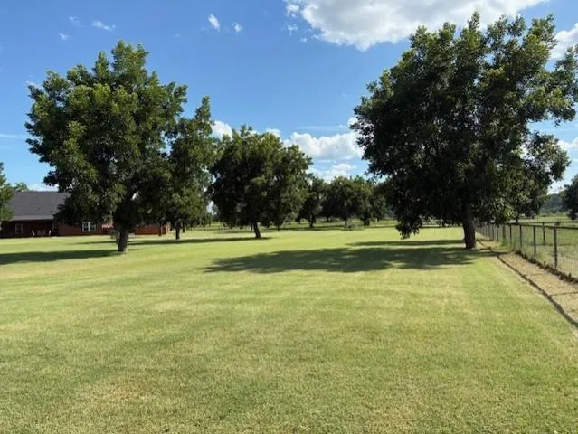 a view of a playground with basketball court