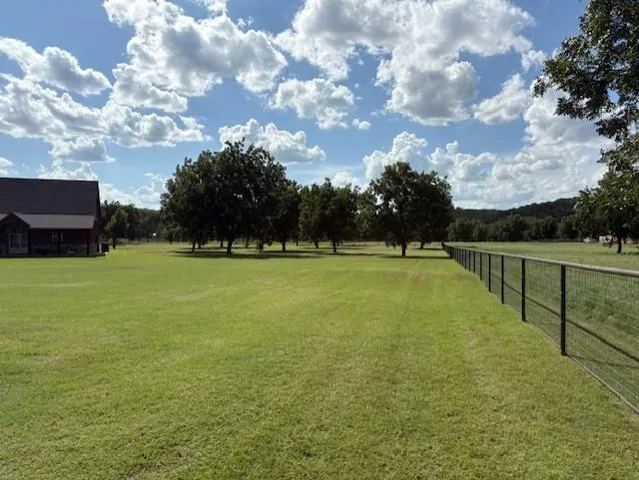 a view of a golf course with a lake