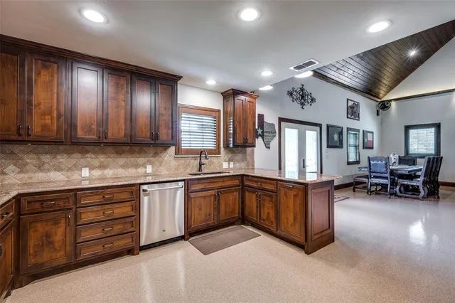 a kitchen with sink cabinets and living room