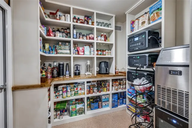 a room with storage and a book shelf