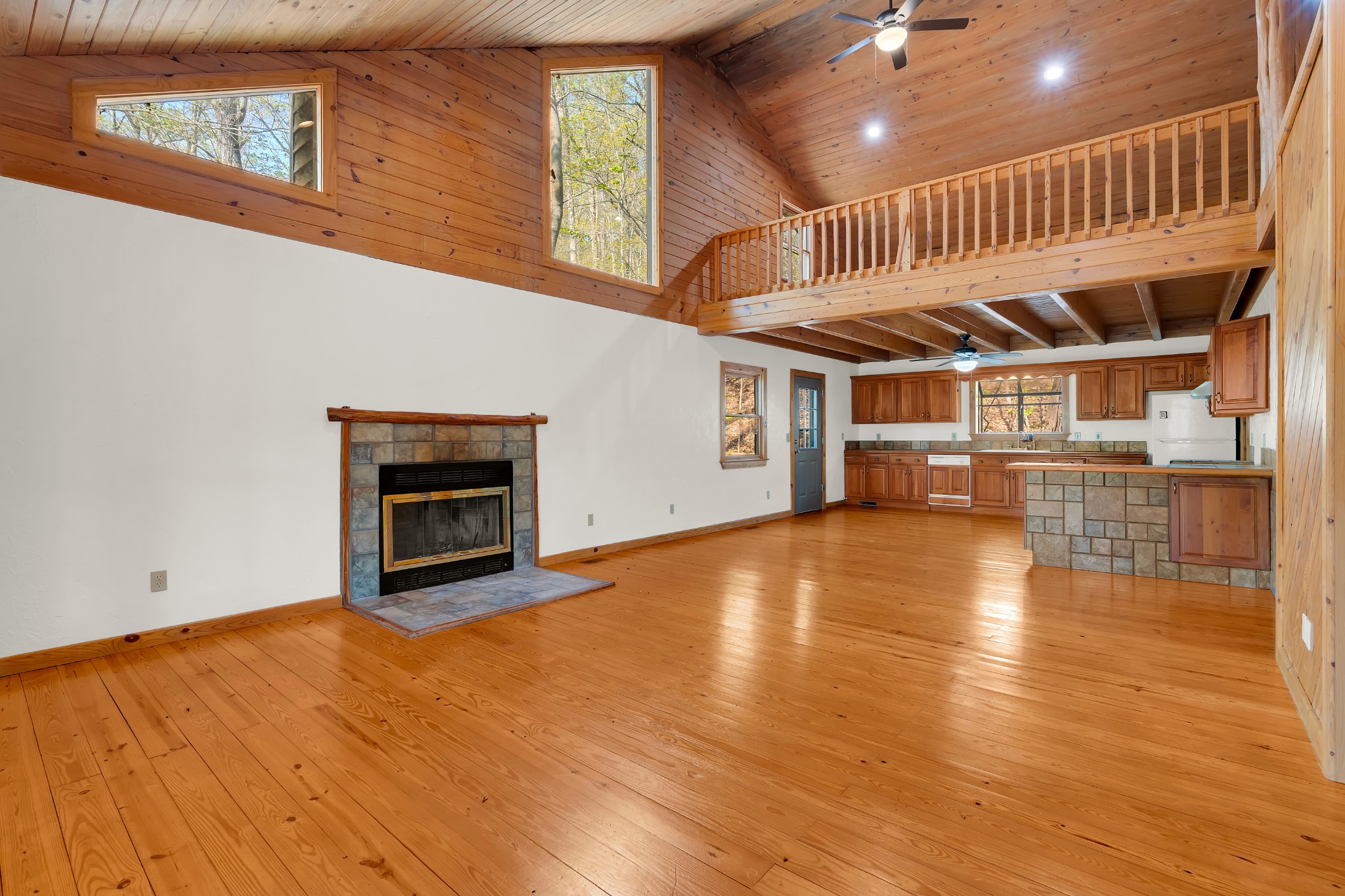 551 Shippmans Creek Road Wartrace, TN 37183 - Photo 5 of 75 a view of an empty room with wooden floor a fireplace
