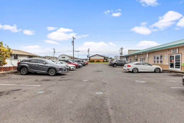 a view of cars parked in front of a building