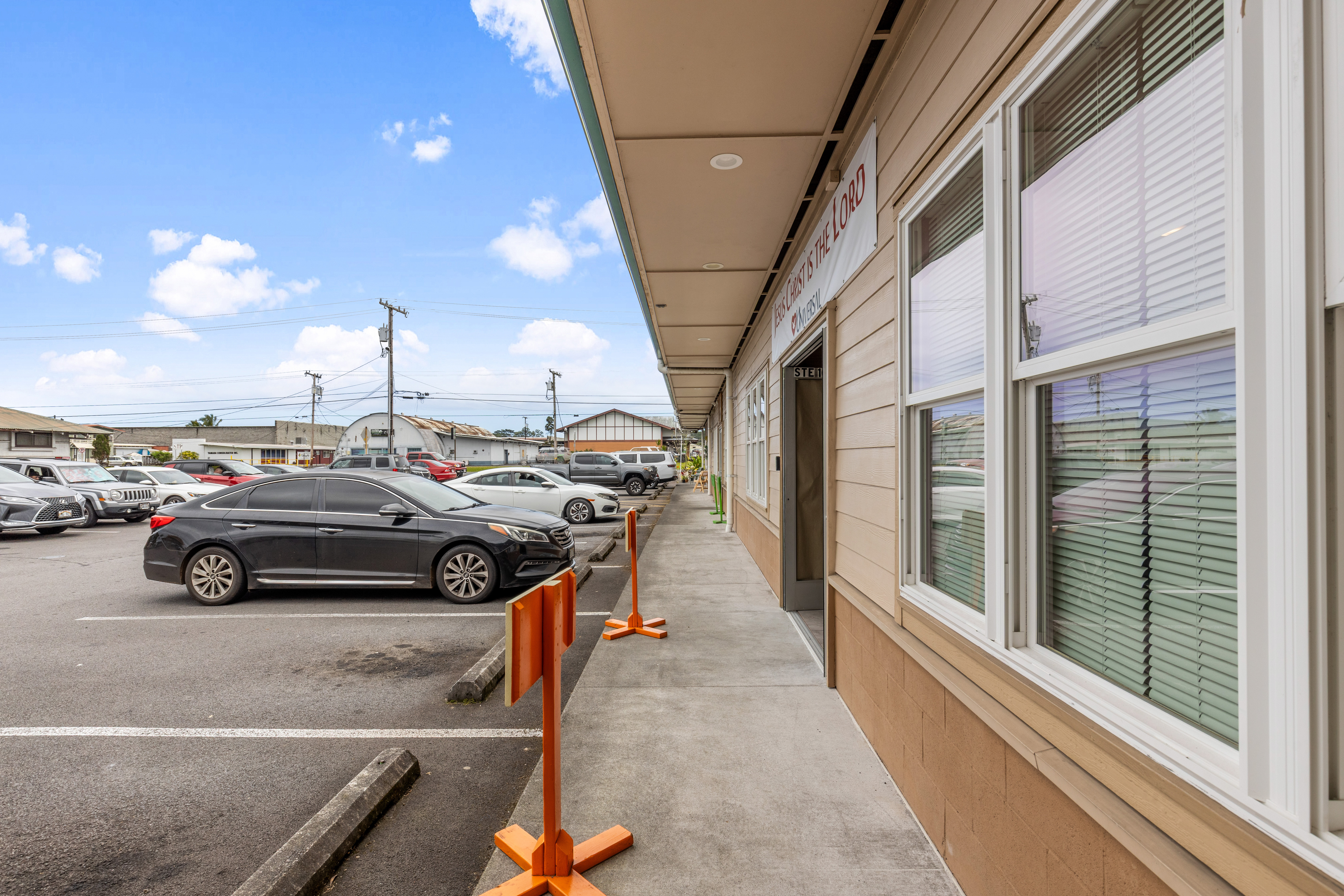 750 Kanoelehua Avenue, Unit 4 Hilo, HI 96720 - Photo 15 of 25 a view of a cars park in front of a building