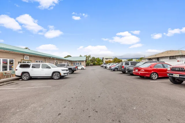 a view of a cars parked in front of a building