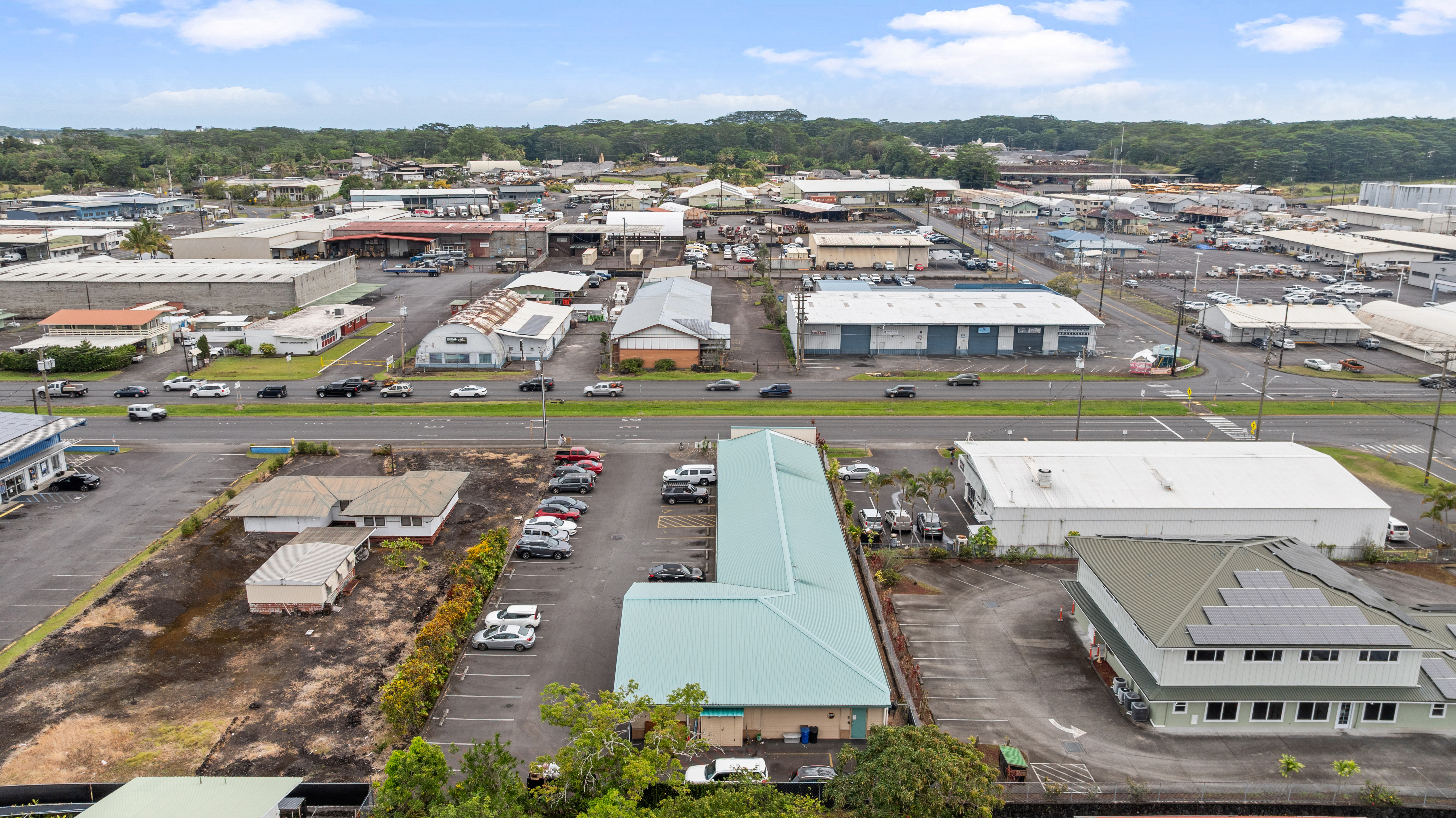 750 Kanoelehua Avenue, Unit 4 Hilo, HI 96720 - Photo 2 of 25 an aerial view of residential houses with outdoor space and ocean view