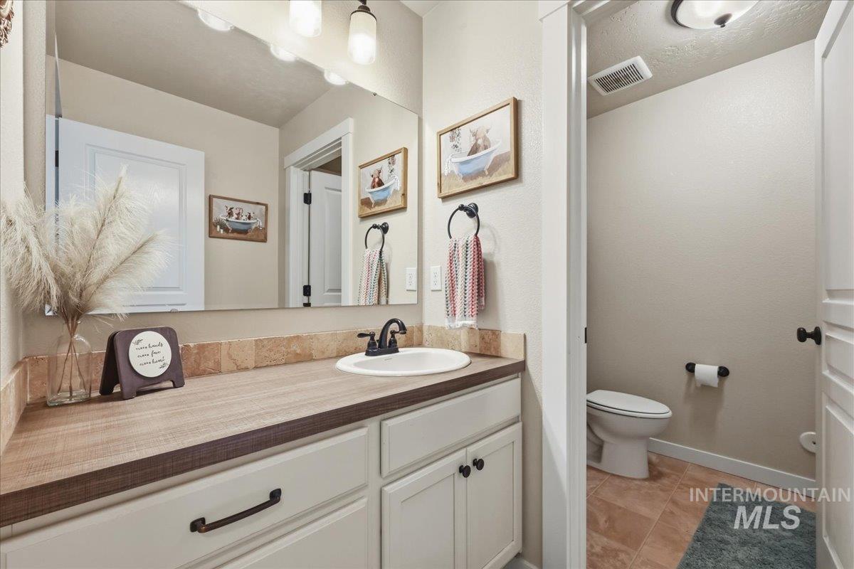 13314 Bloomfield Drive Caldwell, ID 83607 - Photo 13 of 32 Bathroom with vanity and light tile patterned flooring