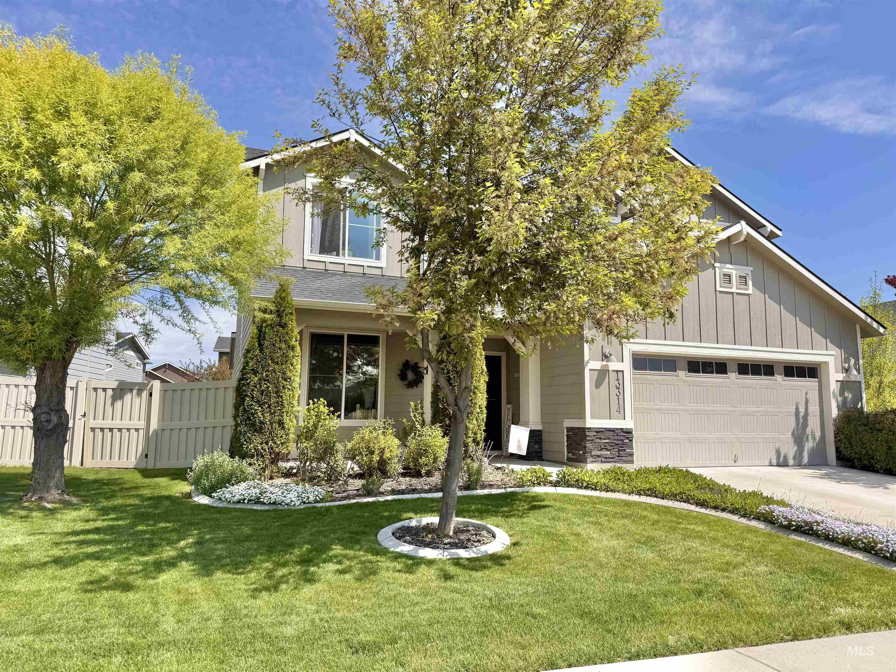 13314 Bloomfield Drive Caldwell, ID 83607 - Photo 29 of 32 Two-story residence featuring light gray siding with board and batten accents