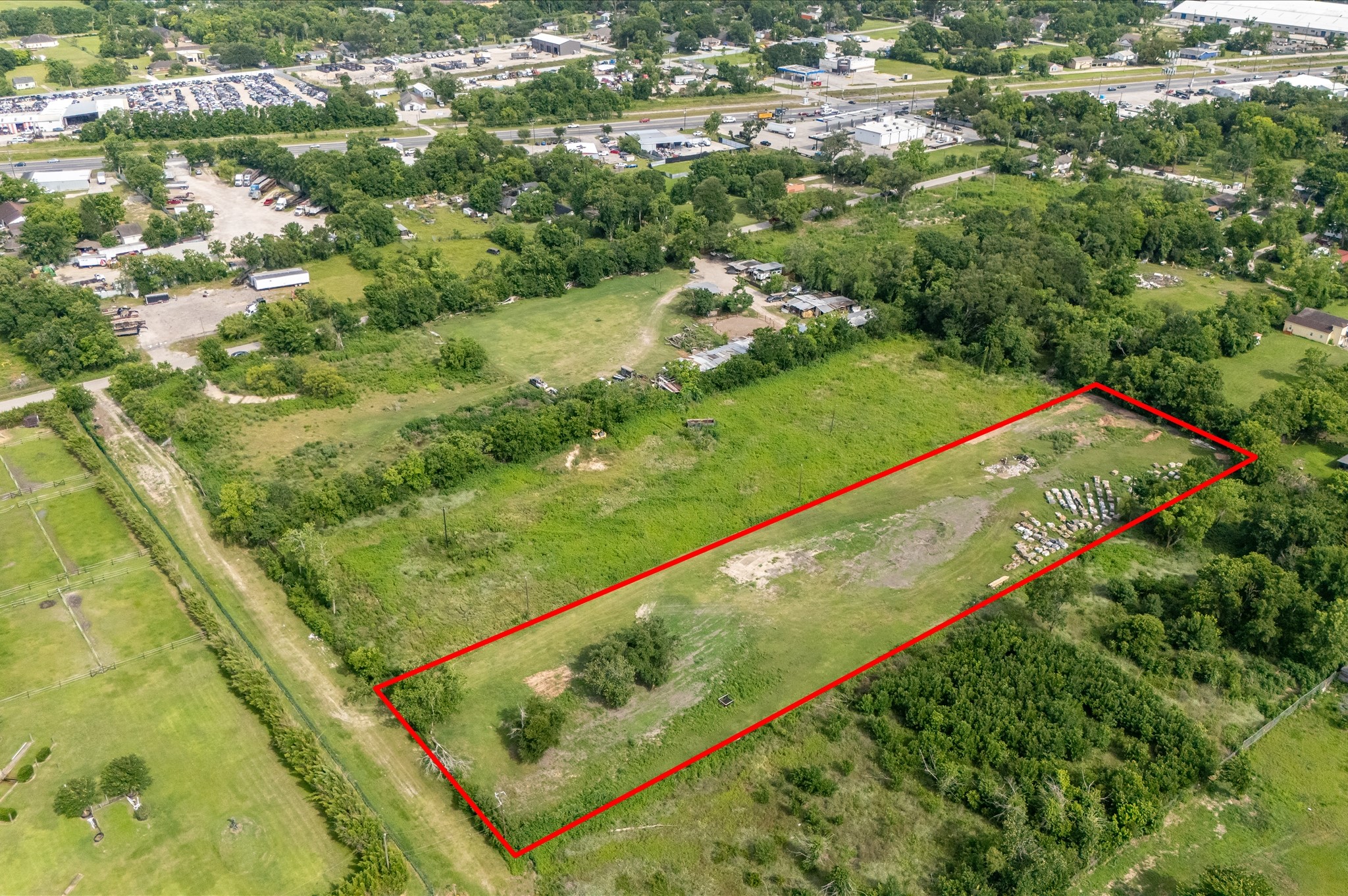 0 Gumas Street Houston, TX 77053 - Photo 4 of 4 a view of a yard with a lush green forest