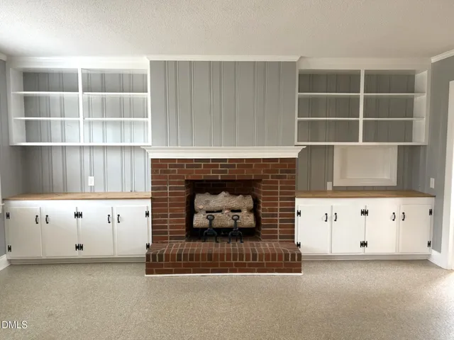 a living room with a fireplace
