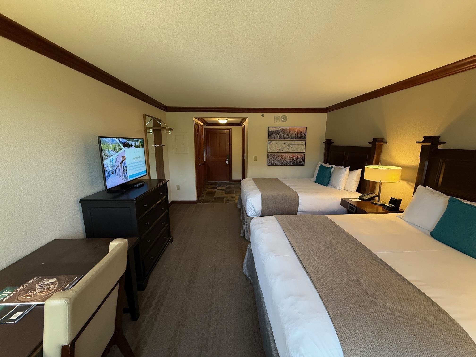 400 Resort Road, Unit 532 Olympic Valley, CA 96146 - Photo 6 of 21 a bedroom with furniture and a flat screen tv