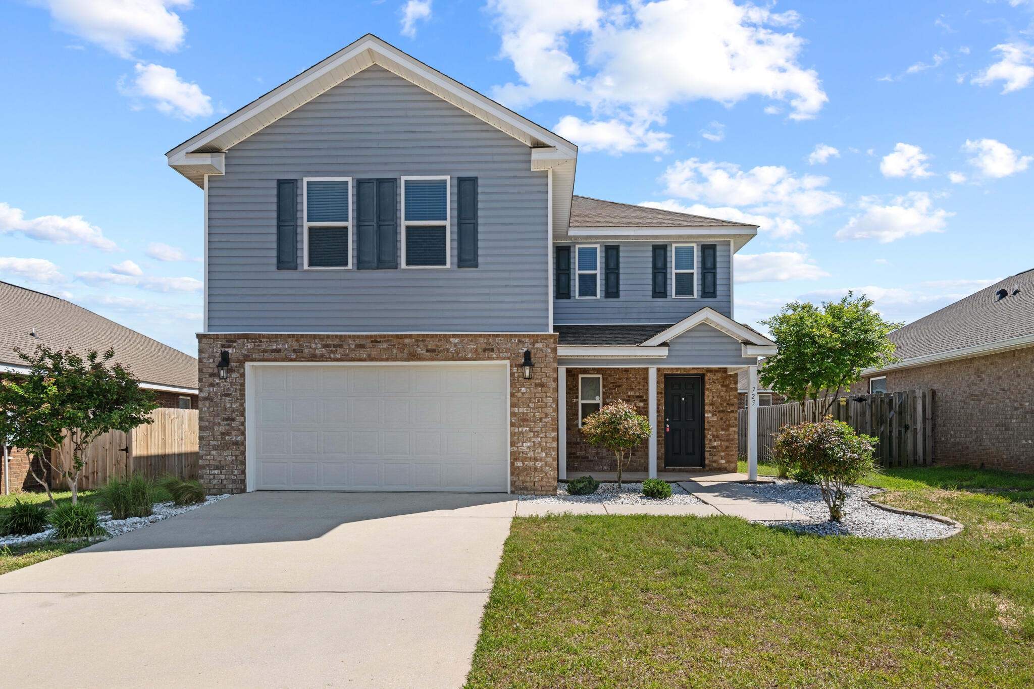 725 Widgeon Way Crestview, FL 32539 - Photo 1 of 16 a front view of a house with a yard