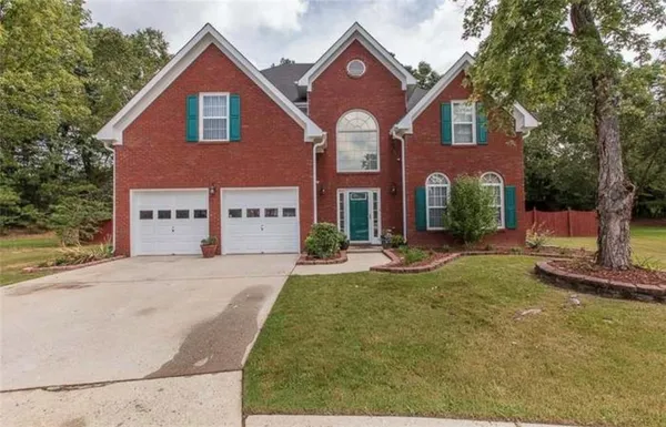 front view of a house with a yard