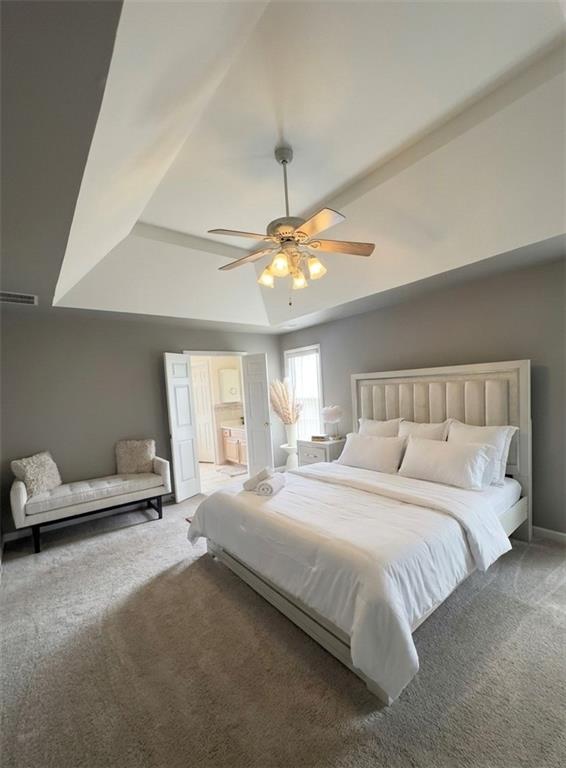 3701 Landau Lane Southwest Atlanta, GA 30331 - Photo 10 of 14 a bedroom with a large bed and a chandelier