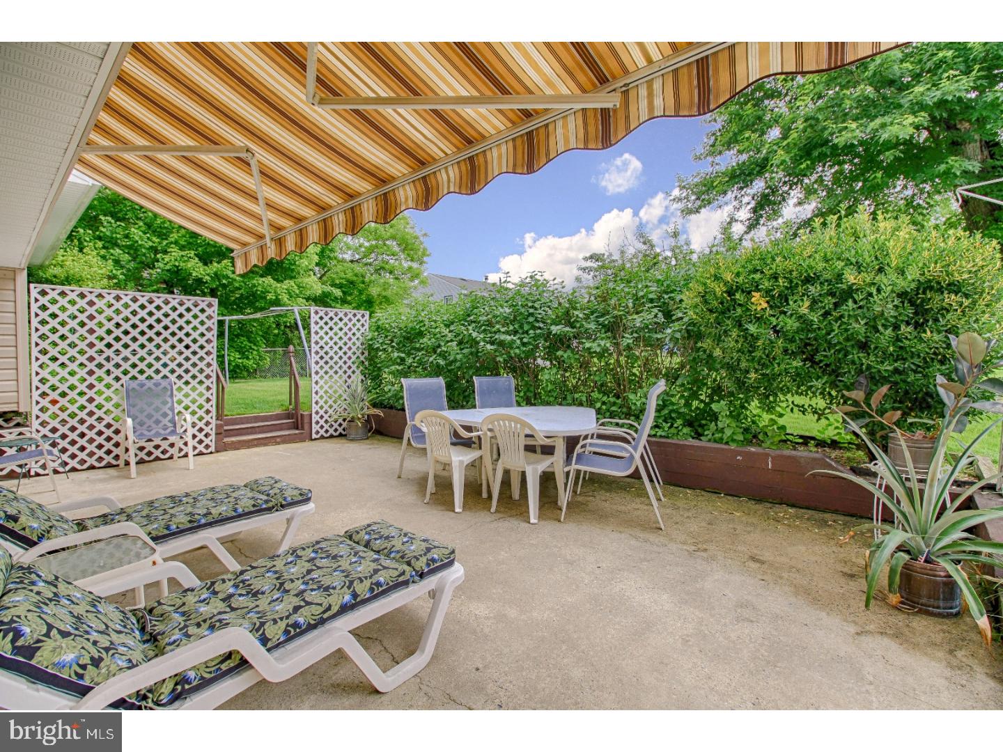 209 Pelham Road South Voorhees, NJ 08043 - Photo 22 of 25 a view of a backyard with a patio and outdoor seating