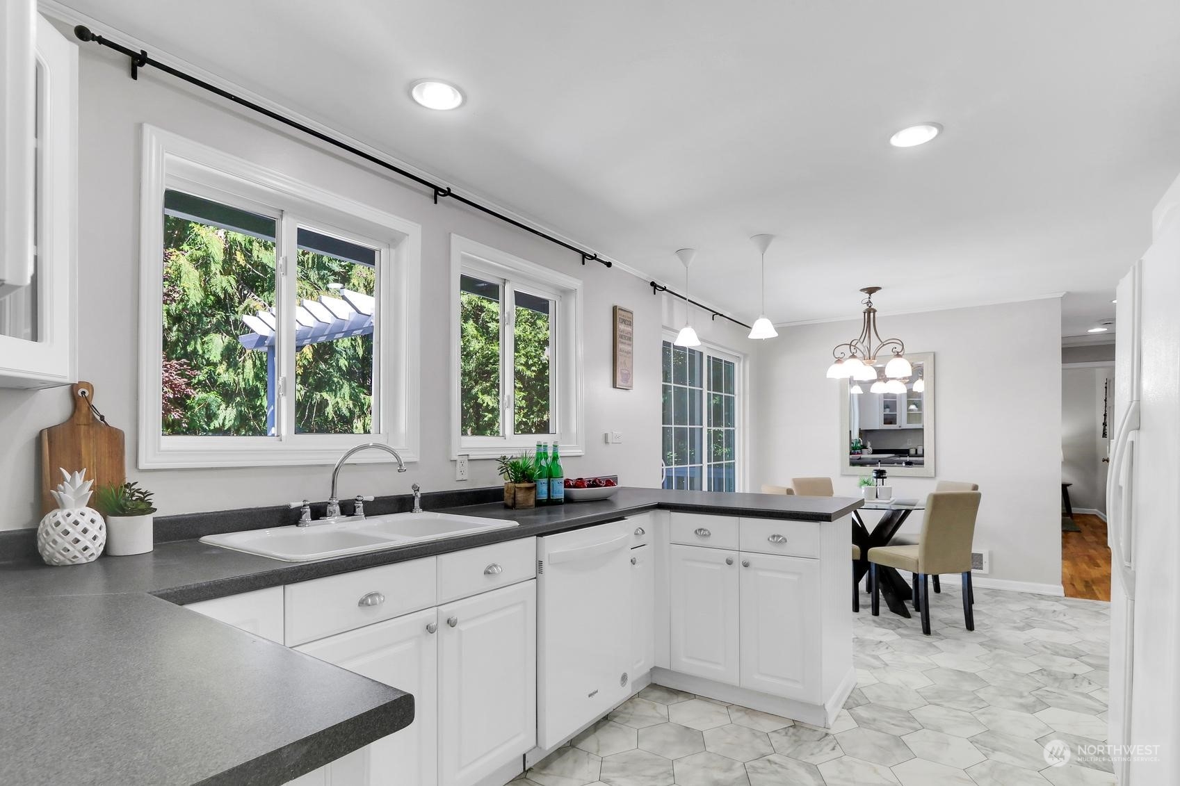 103 231st Street Southeast Bothell, WA 98021 - Photo 11 of 33 a large white kitchen with a large window