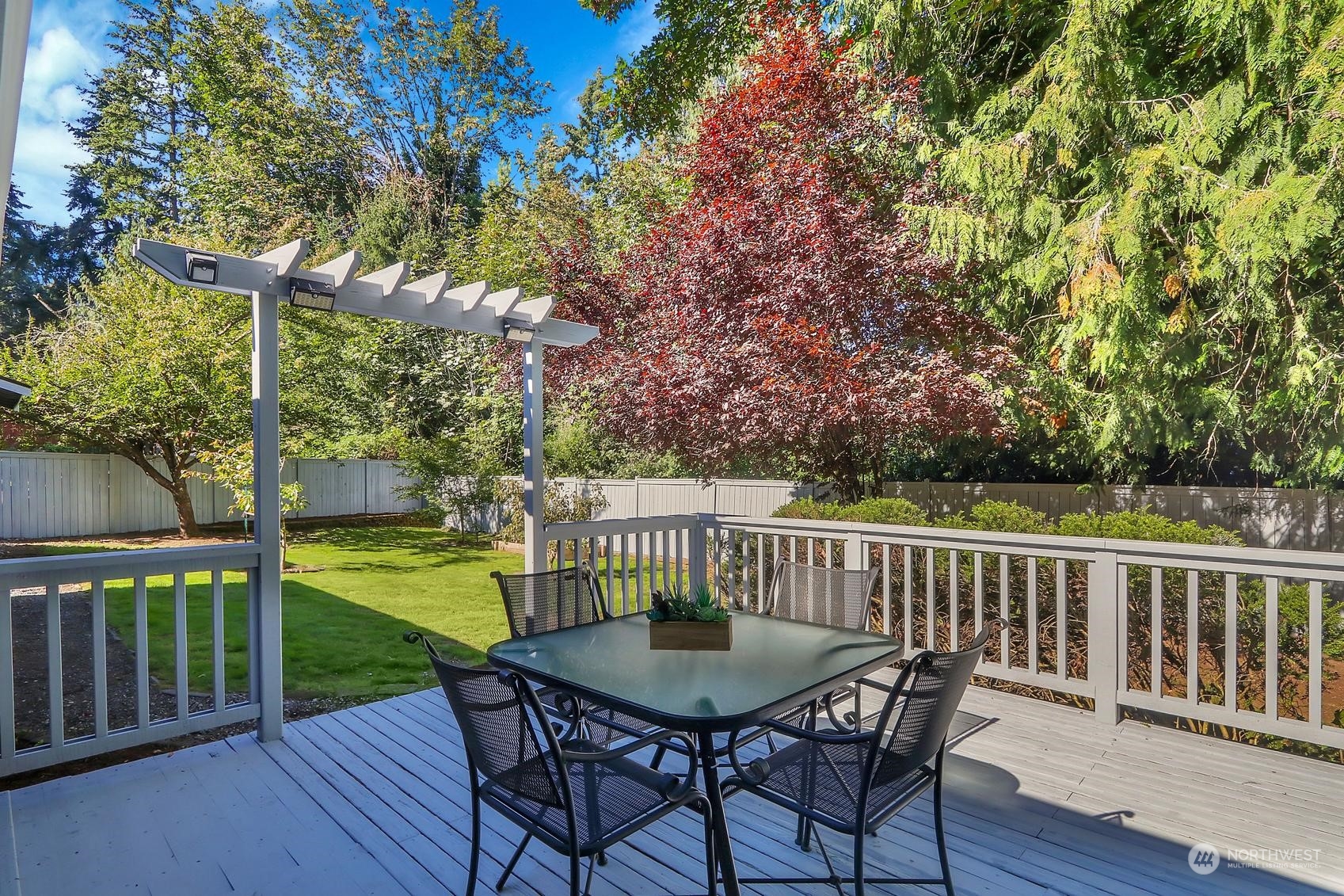 103 231st Street Southeast Bothell, WA 98021 - Photo 15 of 33 a view of a deck with a table and chairs
