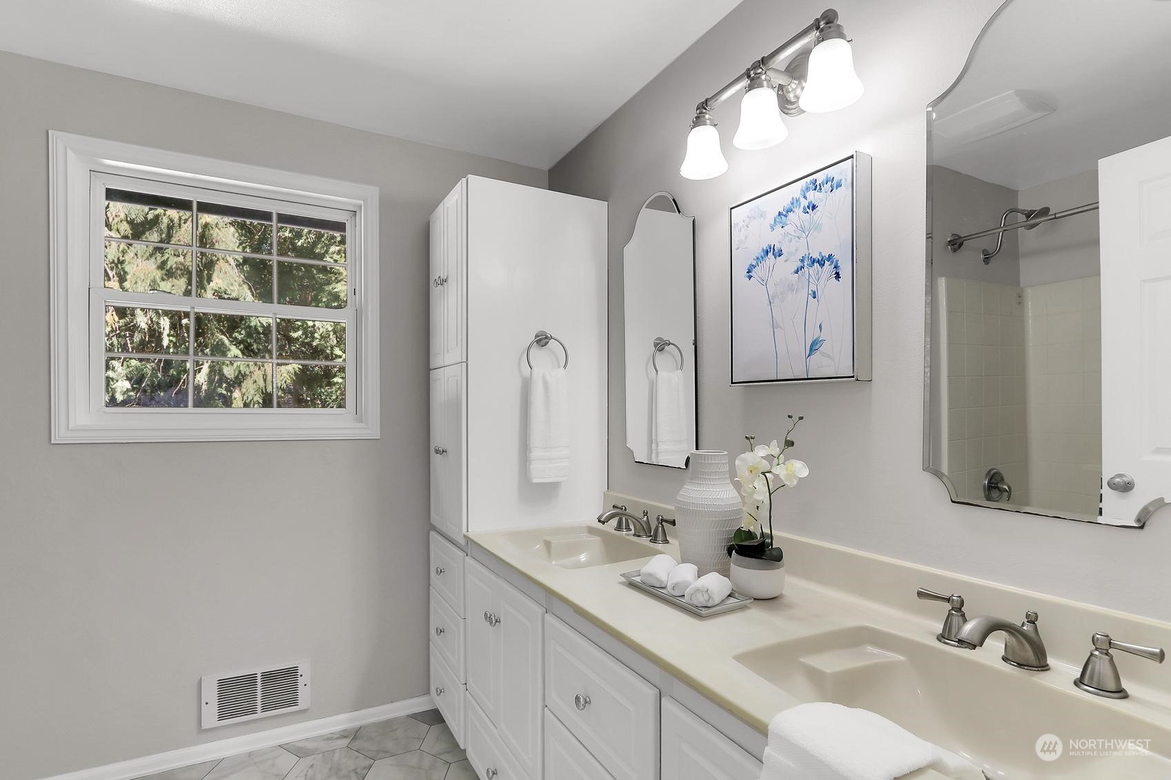 103 231st Street Southeast Bothell, WA 98021 - Photo 24 of 33 a bathroom with double vanity sinks a mirror and a window