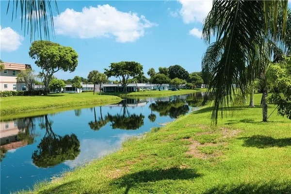a view of a lake with a yard