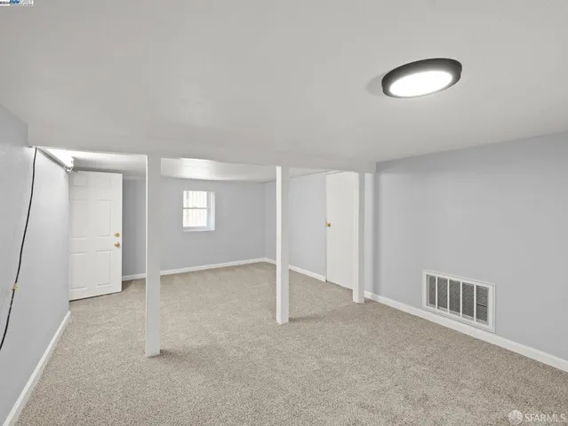 a view of an empty room and window