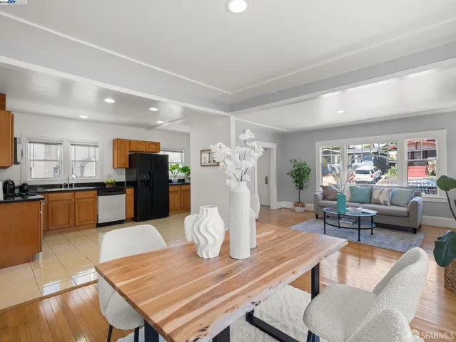 a living room with furniture and kitchen view