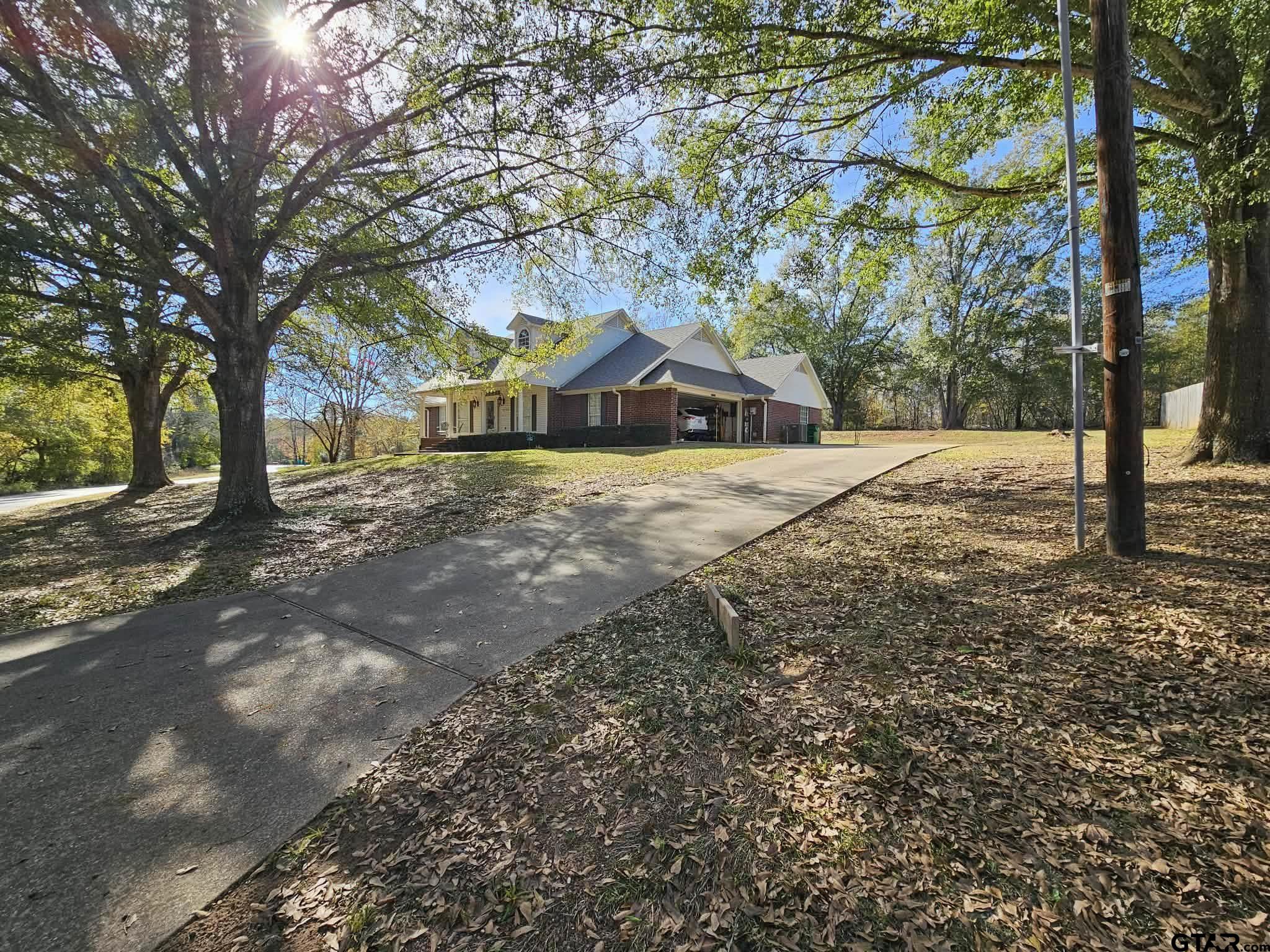 a wooden bench sitting in front of a house