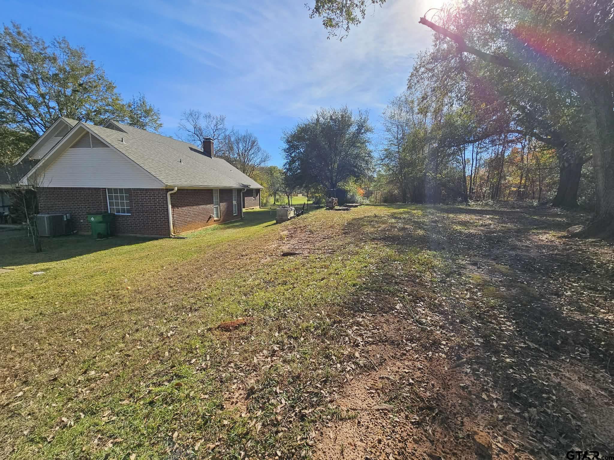 2001 Venture View Palestine, TX 75803 - Photo 17 of 28 a view of a house with a yard