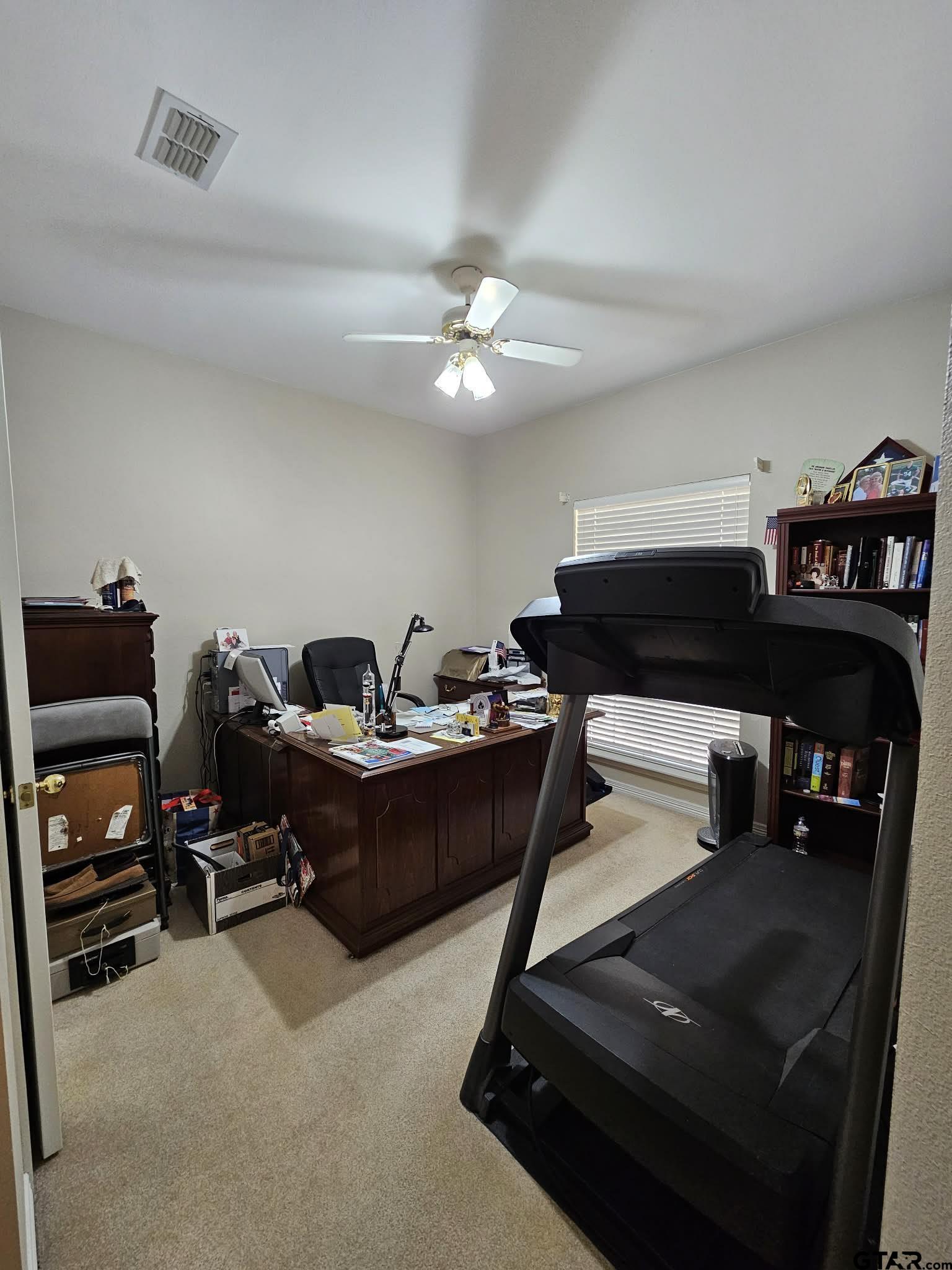 2001 Venture View Palestine, TX 75803 - Photo 27 of 28 a living room with furniture and a ceiling fan