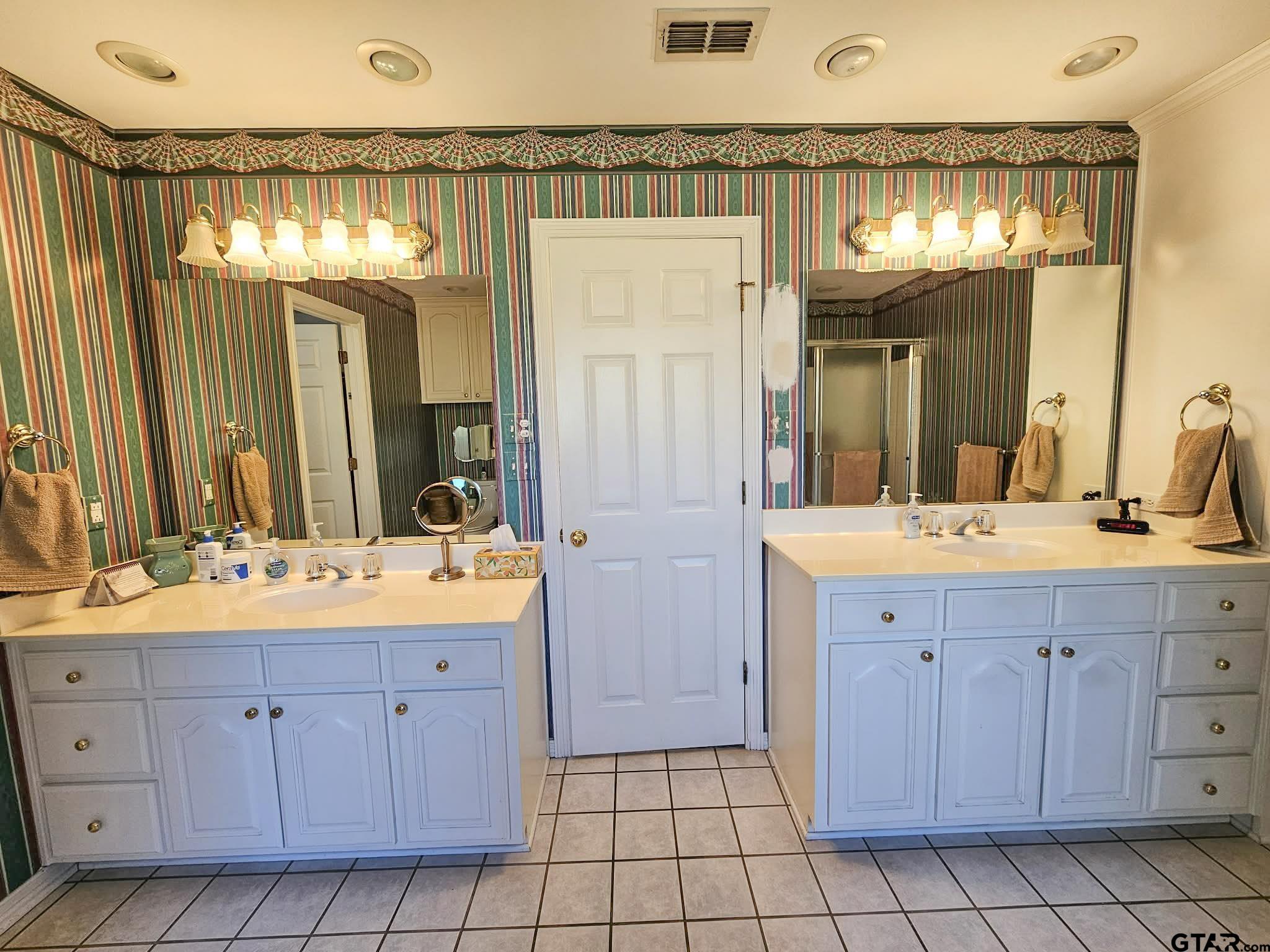 2001 Venture View Palestine, TX 75803 - Photo 3 of 28 a bathroom with a double vanity sink mirror and