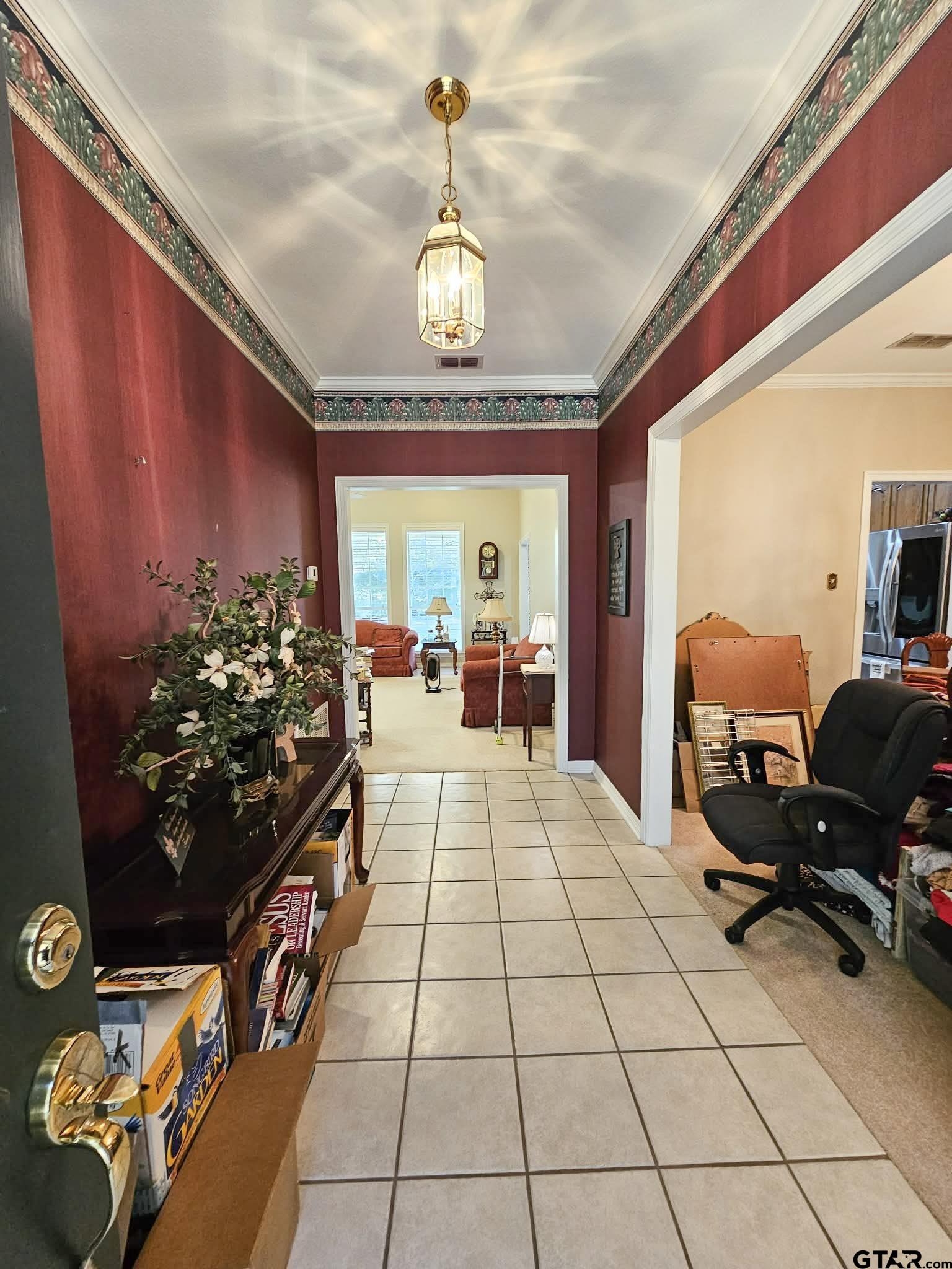2001 Venture View Palestine, TX 75803 - Photo 6 of 28 a room with gym equipment and a chandelier