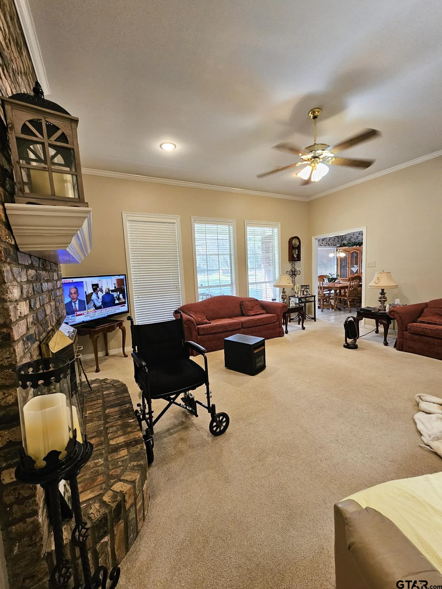 2001 Venture View Palestine, TX 75803 - Photo 9 of 28 a living room with furniture and a chandelier