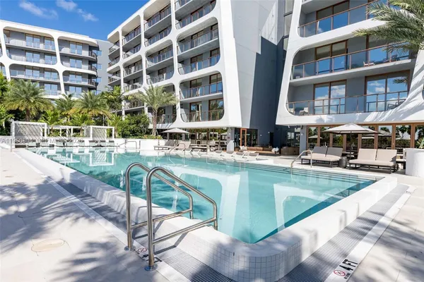 a large building with a swimming pool