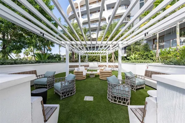a room with pool table and windows