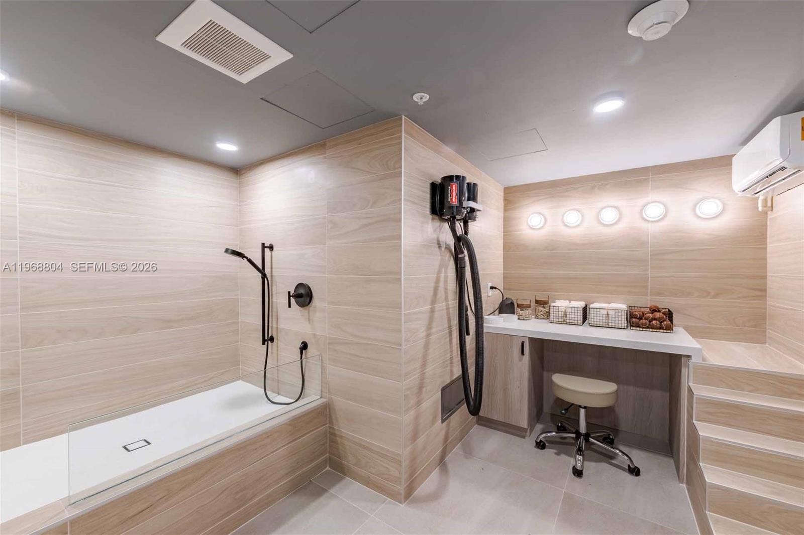 3900 Alton Road, Unit 422 Miami Beach, FL 33140 - Photo 40 of 42 a bathroom with a sink a toilet and shower