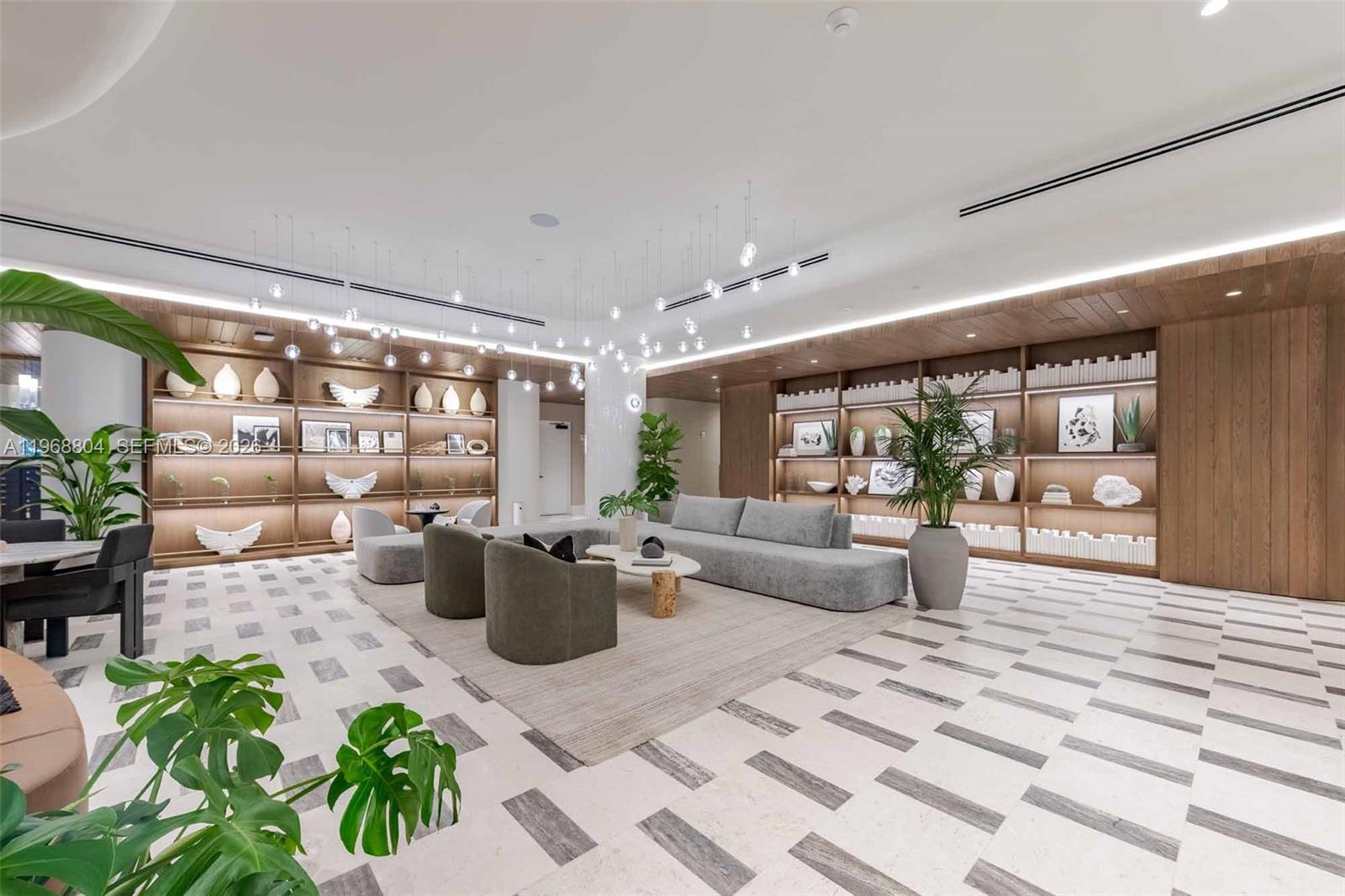 3900 Alton Road, Unit 422 Miami Beach, FL 33140 - Photo 9 of 42 a living room with furniture and a potted plant