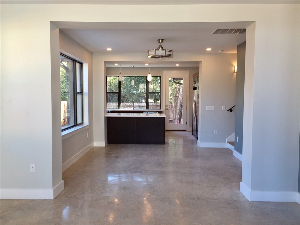 5621 Adams Avenue, Unit B Austin, TX 78756 - Photo 6 of 7 a view of a kitchen with large windows and kitchen view
