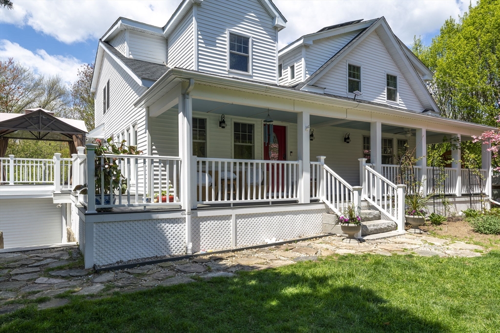 229 Parkerville Road Southborough, MA 01772 - Photo 4 of 38 a view of a house with a yard and deck