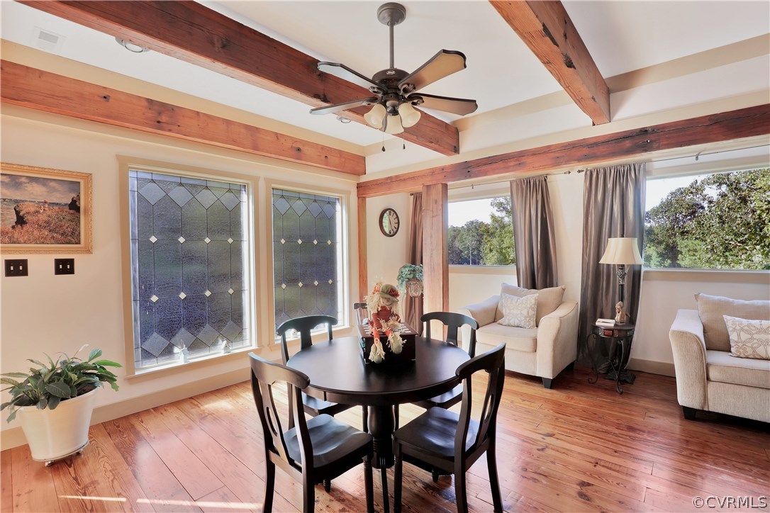 6400 Moseley Road Moseley, VA 23120 - Photo 22 of 47 a dining room with furniture wooden floor and a chandelier