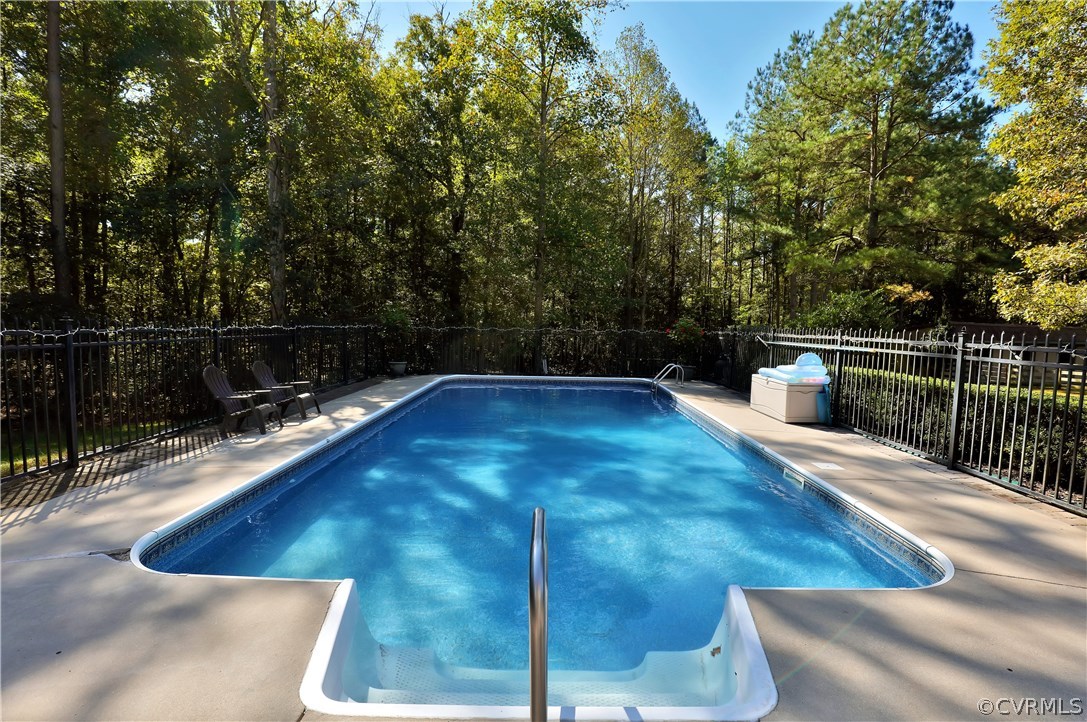 6400 Moseley Road Moseley, VA 23120 - Photo 39 of 47 a view of a swimming pool with a chair