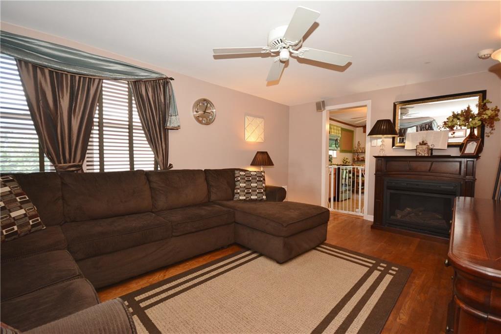 2147 Swallow Hill Road Pittsburgh, PA 15220 - Photo 5 of 19 Living Room with Hardwood Floors and a Gas Fireplace