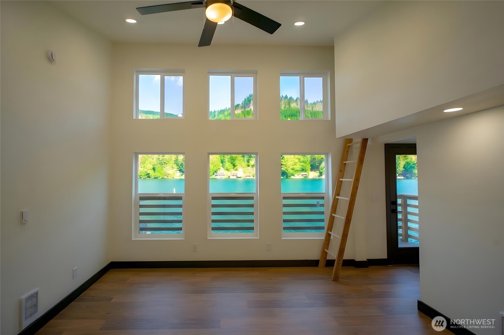 570 South Shore Road Port Angeles, WA 98363 - Photo 11 of 40 wooden floor in an empty room with a window