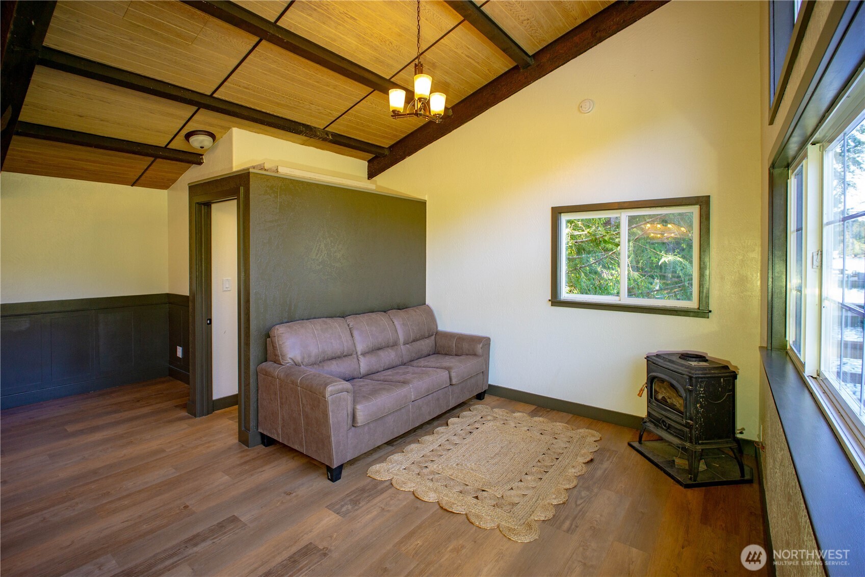 570 South Shore Road Port Angeles, WA 98363 - Photo 16 of 40 a living room with furniture and a flat screen tv