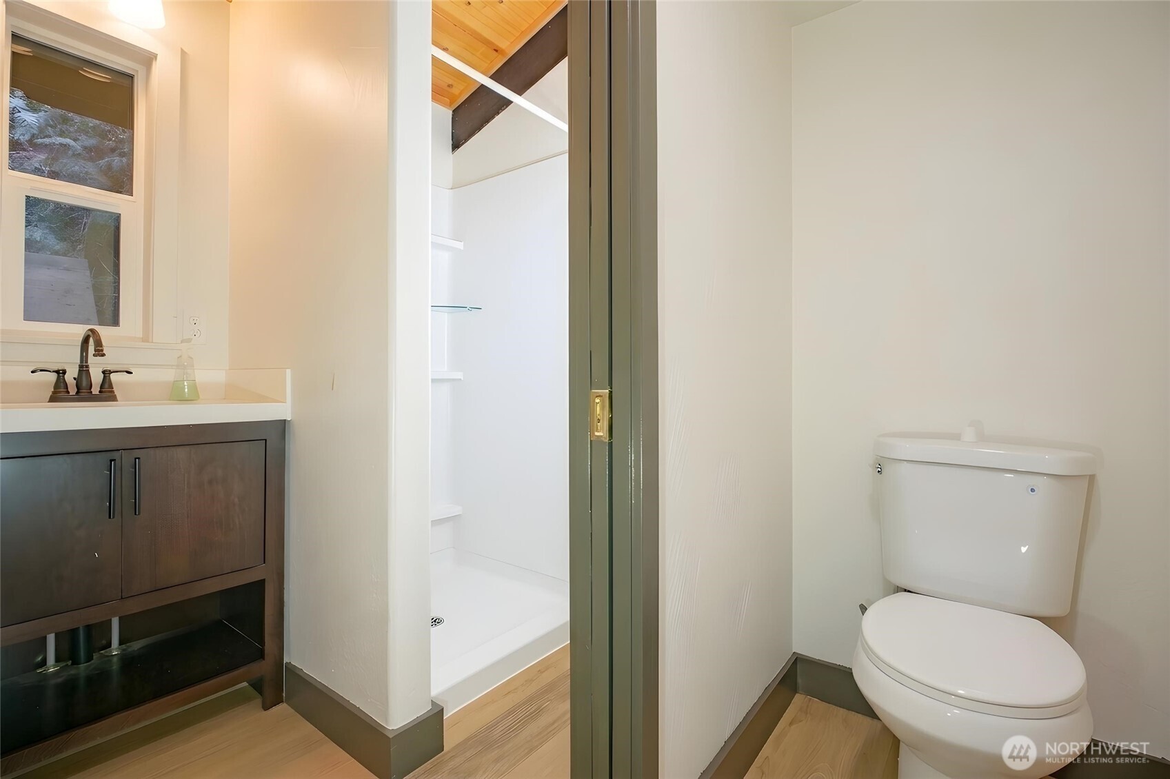 570 South Shore Road Port Angeles, WA 98363 - Photo 24 of 40 a white toilet sitting next to a bathroom sink